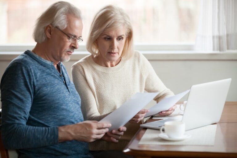 couple paying bills min