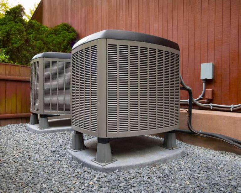 ac units behind wooden wall