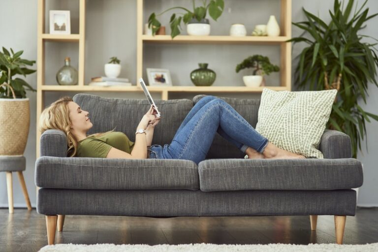 woman relaxing on couch min